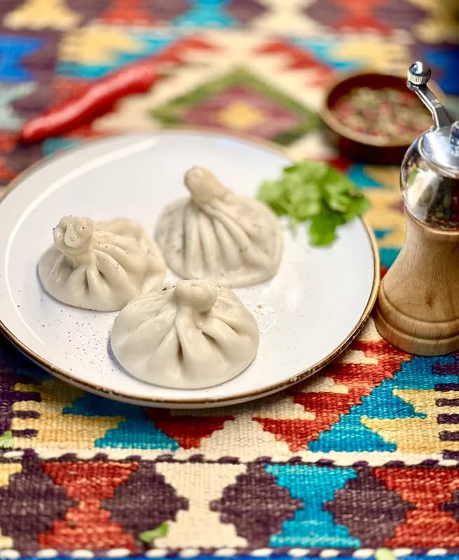 Khinkali — traditional Georgian dish filled   with juicy meat and hot broth inside